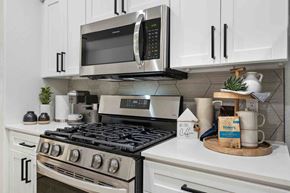 Glendale apartment for rent - a kitchen with white cabinets and stainless steel appliances