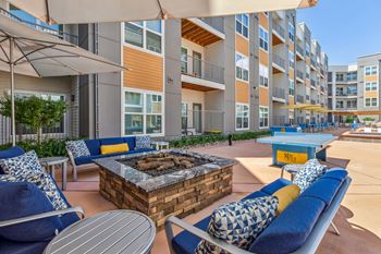 Sundeck with lounge seating and firepit