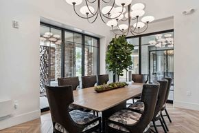 Chandler apartment for rent - A dining room with a wooden table and chairs.