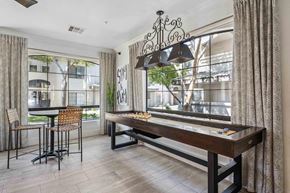 Chandler apartment for rent - A dining room with a wooden table and chairs.