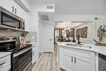 Custom cabinetry with matte black accessories