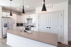 Aurora apartment for rent - A kitchen with a white counter and cabinets.