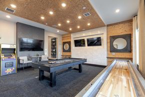 Aurora apartment for rent - A room with a pool table and a foosball table.