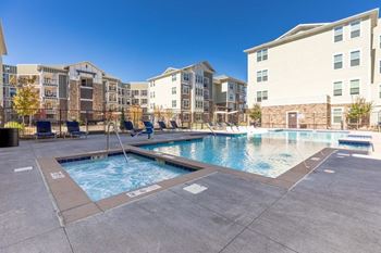 Year-round swimming pool, spa-inspired hot tub and sundeck with lounge seating