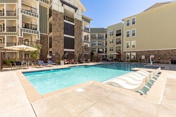 Year-round swimming pool, spa-inspired hot tub and sundeck with lounge seating