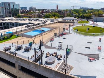 Rooftop featuring grills and seating areas