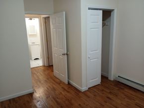 Elizabeth apartment for rent - A room with a white door and a wooden floor.