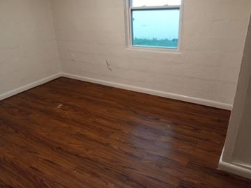 Orlando apartment for rent - A room with wooden flooring and a window.