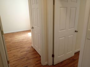 Elizabeth apartment for rent - A white door is closed and has a black handle.