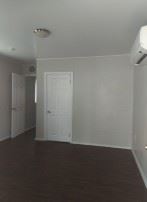 Orlando apartment for rent - A room with a white door and a window.
