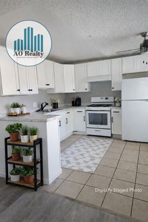 Rohnert Park apartment for rent - AO Realty logo on a kitchen ceiling.