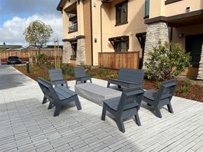 Santa Rosa apartment for rent - A set of grey outdoor furniture is arranged on a brick patio.