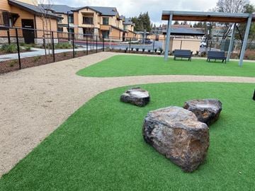 Santa Rosa apartment for rent - A playground with a green surface and rocks.