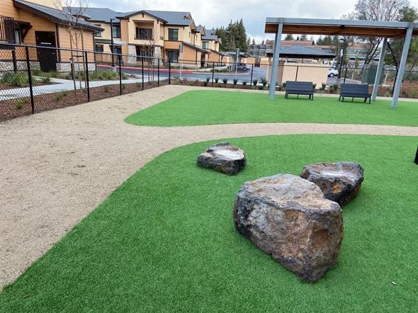 Santa Rosa apartment for rent - A playground with a green surface and rocks.