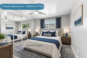 Davis apartment for rent - A bedroom with two beds and a ceiling fan.