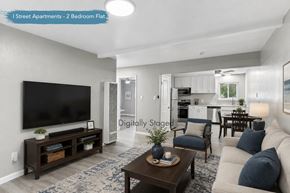 Davis apartment for rent - A living room with a flat screen TV and a coffee table.