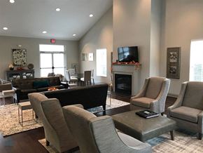 Knoxville apartment for rent - A living room with a fireplace and a television.