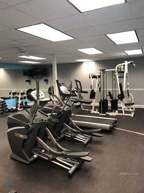 Knoxville apartment for rent - A gym with treadmills and elliptical machines.