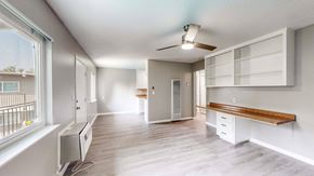 Davis apartment for rent - A well-lit, spacious room with a window, a bench, and a ceiling fan at Pennsylvania Place, Davis, CA