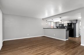 Chico apartment for rent - Open concept living and dining area with kitchen bar at Redwood Cove Apartments, Chico, CA