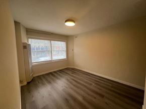 San Francisco apartment for rent - Empty room with a window and a door.