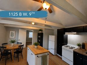 Chico apartment for rent - A kitchen with a table and chairs and a ceiling fan.