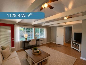 Chico apartment for rent - A living room with a white couch and a coffee table in the middle.