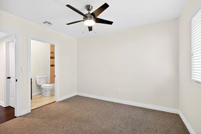 Los Angeles apartment for rent - A room with a ceiling fan and a carpeted floor.