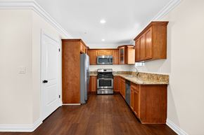 Los Angeles apartment for rent - A kitchen with wooden cabinets and a granite countertop.
