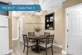 Chico apartment for rent - A dining room with a table set for two and a framed picture on the wall.