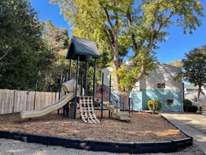 Chico apartment for rent - A playground with a slide, swings, and a climbing frame.
