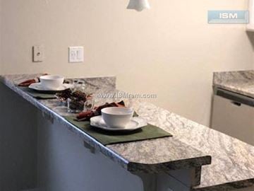 Chico apartment for rent - A kitchen counter with a white plate and a bowl on it.