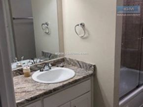 Chico apartment for rent - A bathroom with a sink and a mirror.