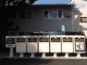 Chico apartment for rent - A series of signs for Menlo Pointe Clubhouse and parking.