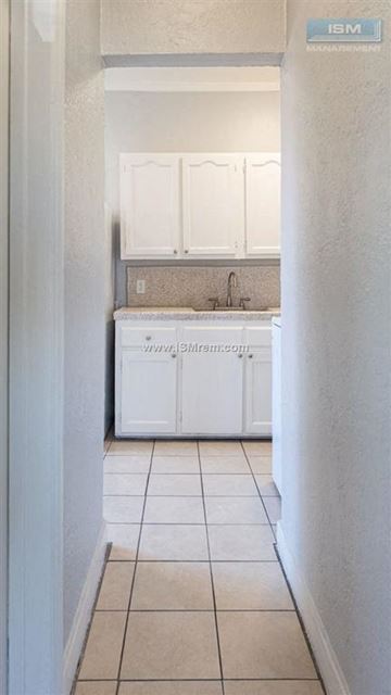 Los Angeles apartment for rent - A white kitchen with a sink and cabinets.