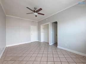 Los Angeles apartment for rent - A room with a ceiling fan and tile flooring.
