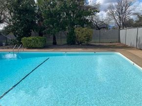 Redding apartment for rent - A rectangular pool with a blue tinted water.