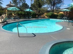 Redding apartment for rent - A pool with a metal ladder and a website address on the side.
