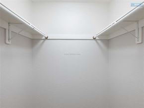 Sherman Oaks apartment for rent - A white wall with a shelf and pipes.
