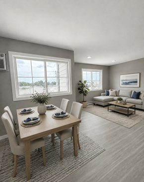 Champaign apartment for rent - A dining room with a table set for four and a couch in the background.