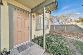 Redding apartment for rent - A house with a brown door and a small porch.