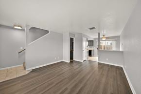 Redding apartment for rent - A spacious room with wooden flooring and white walls.
