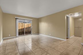 Chico apartment for rent - Spacious living room with sliding glass door at Cedar Park Apartments, California