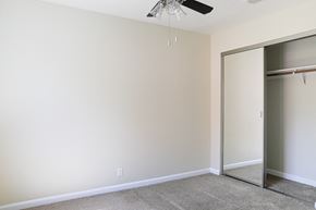 Chico apartment for rent - an empty room with a closet and a ceiling fan at Creekview Homes, Chico, CA, 95928