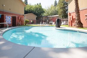 Chico apartment for rent - Outdoor swimming pool with surrounding buildings at Pomona Townhomes Apartments, Chico