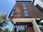 Berkeley apartment for rent - A tall building with the number 26 on it at 26FIFTY Apartments, Berkeley, CA