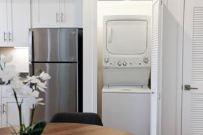 Napa apartment for rent - A white refrigerator and oven in a kitchen with a table and chairs.