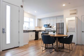 Napa apartment for rent - A kitchen with a table and chairs in the middle of the room.