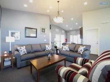 Elko apartment for rent - A living room with a grey couch and a wooden coffee table.
