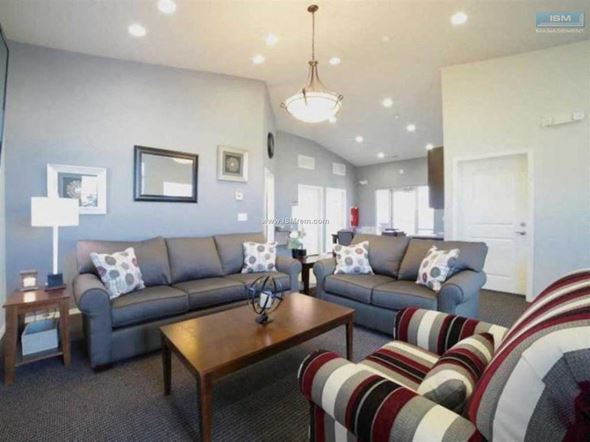 Elko apartment for rent - A living room with a grey couch and a wooden coffee table.